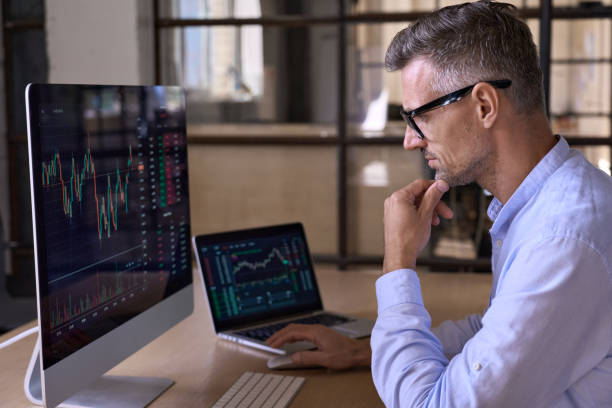 Crypto trader investor using computer cryptocurrency stock market trading chart. Crypto trader investor analyst broker using pc computer analyzing digital cryptocurrency exchange stock market charts graphs thinking of investing funds risks in trading platform global analytics. stock trader stock pictures, royalty-free photos & images