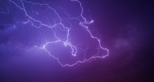 istock Striking purple lightening during a severe thunderstorm 1350800628