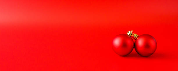 istock Christmas bauble on red background new year  holiday celebration concept 1350802703
