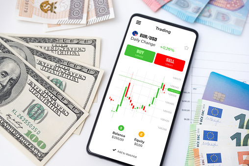 Trading mobile app, currency, stock market concept. Online investment on smart phone