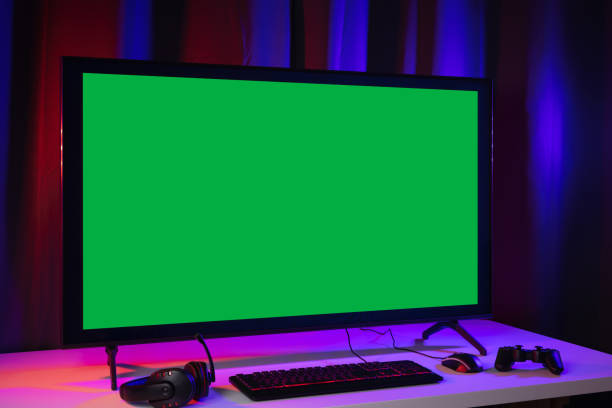 istock Blank screen display computer pc with gaming gear joystick mouse keyboard mouse. Gamer gadget background in game station. 1350804406