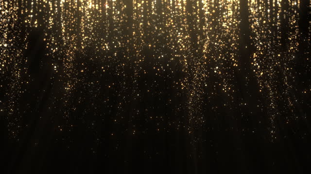Loopable Glittering particles falling in slow motion - christmas, glamour, abstract falling particles background in Gold