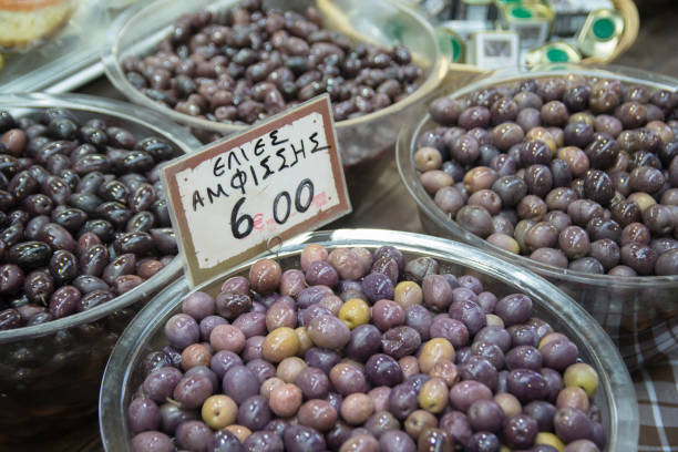 Olives for sale (In Greek: "Olives from Amfisa") at a market in Thessaloniki, Greece stock photo