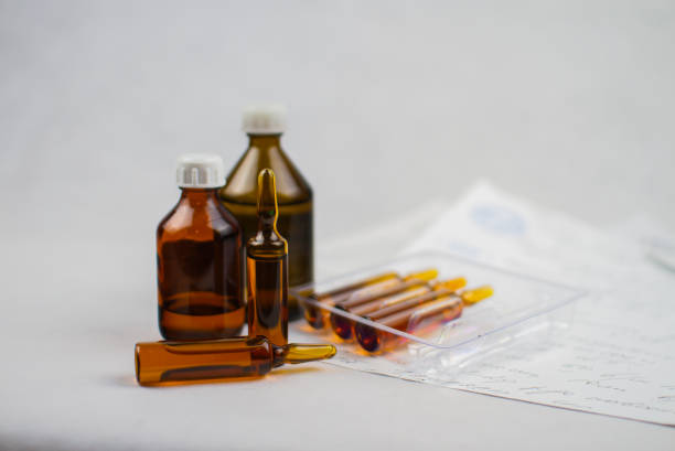 istock Syringe and ampoules on the table 1350814458
