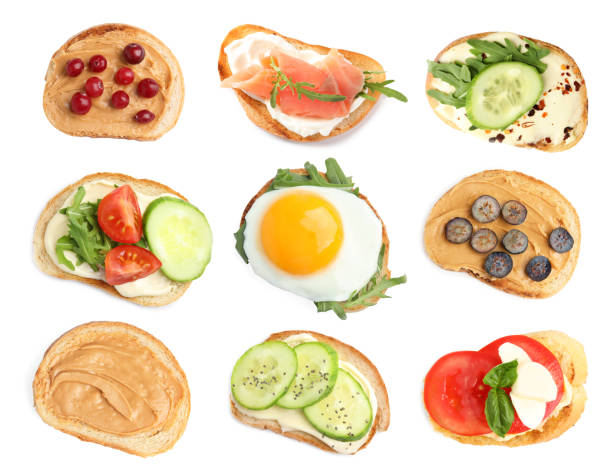 istock Set of toasted bread with different toppings on white background, top view 1350817377