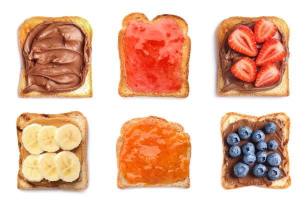 istock Set of toasted bread with different toppings on white background, top view 1350817390