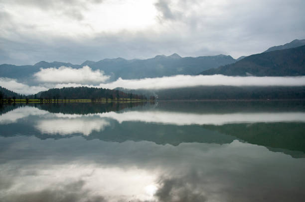 istock Reflections in the Bohinj lake on a cloudy day 1350819356