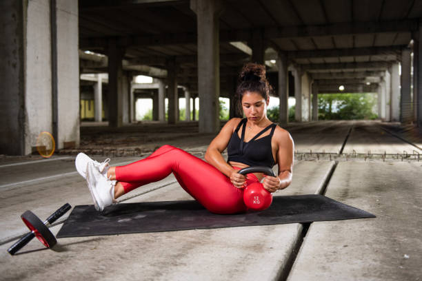 istock Fit woman training with weights outdoor 1350823576