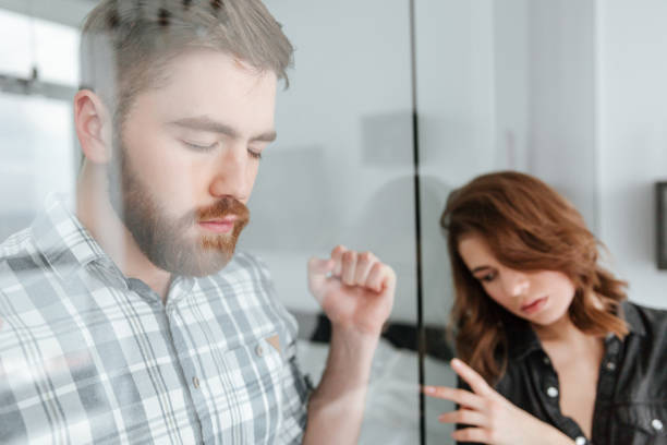 istock Young quarel loving couple standing at home indoors. 1350824092