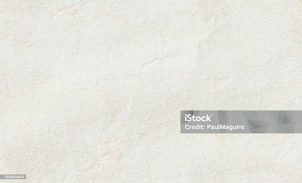 Seamless tileable vintage parchment paper texture background Seamless and tileable paper texture background. Close up of vintage off white, rough parchment paper texture Textured Stock Photo