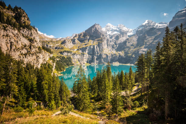 Lake Oeschinen above Kandersteg in Switzerland a beautiful place to walk and relax. The turquoise lake invites you for swimming or boating. Dominic stock pictures, royalty-free photos & images