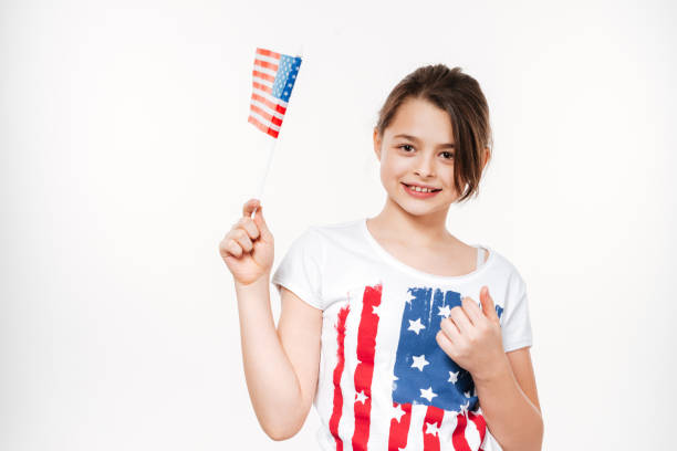 istock Young girl holding USA flag 1350826063