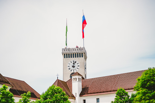 Ljubljana, Slovenia - May 25 2019: Picture of the inner courtyard of Ljubljana castle in winter, with the outlook tower in the background. Ljubljana Castle is a castle complex standing on Castle Hill above downtown Ljubljana, the capital of Slovenia. It is a key landmark of the town.