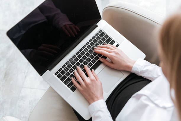 istock Cropped picture of business lady using laptop. 1350829042