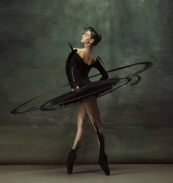 cinematic portrait graceful female ballet dancer posing isolated on dark vintage studio background with drawings. - shoe women retro revival fashion imagens e fotografias de stock