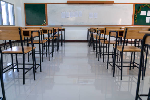 School interior of empty class room with board and seat when nobody or no student in classroom situation of Covid-19 disease outbreak and have to learning of distance teaching during COVID-19 School interior of empty class room with board and seat when nobody or no student in classroom situation of Covid-19 disease outbreak and have to learning of distance teaching during COVID-19 empty desk in classroom stock pictures, royalty-free photos & images