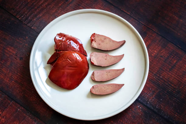 Liver on a wooden board in the kitchen. healthy eating Chinese food: Cooked with fresh lamb liver and spices, cooled and eaten. animal liver stock pictures, royalty-free photos & images