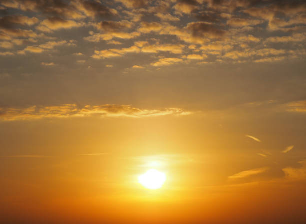 istock A yellow and orange glow in the morning sky 1350833589