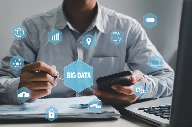 istock businessman holding pen and smartphone icon big data virtual screen. Business technology concept, Business Marketing, Investment and Data Analytics. 1350833799