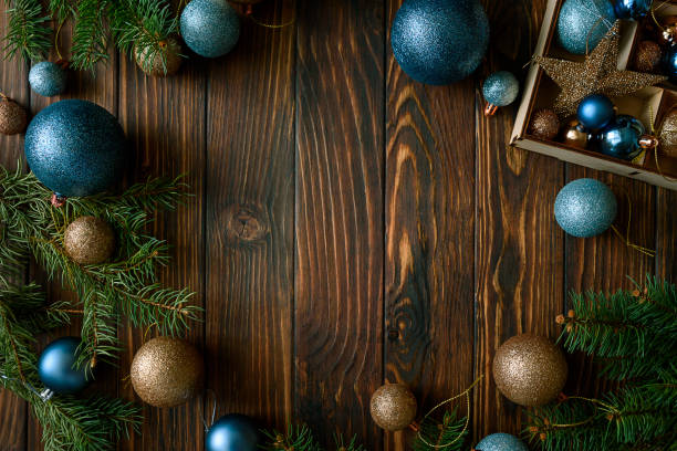 istock Christmas background with decorations on wooden background. Top view. Copy space.  Merry christmas and happy new year celebration concept. Mock-up 1350834292