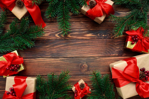 istock Christmas background with decorations and gift boxes on wooden table. Top view. Copy space.  Merry christmas and happy new year 1350834301