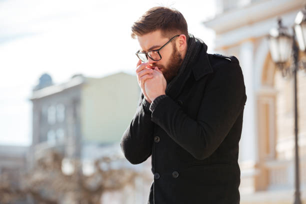 istock Man standing and bowing on hands outdoors in cold weather 1350834877