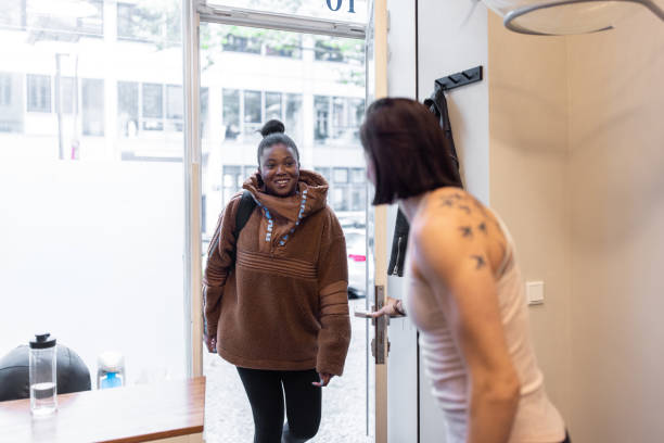 istock Fitness instructor welcoming a woman at a pilates studio 1350834882