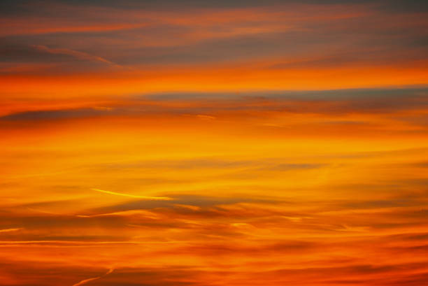 istock Bright orange lines in the morning sky 1350836811