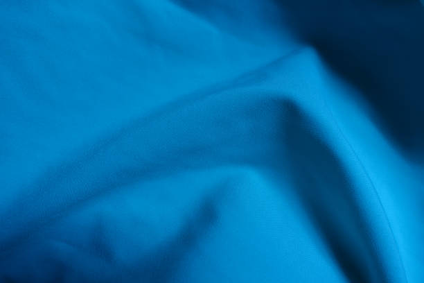 istock Surface of cerulean blue chiffon fabric in soft folds 1350845394