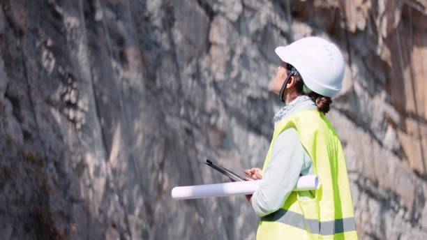 istock Female road construction engineer working. Building new highways. 1350847978