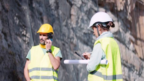 istock Road construction engineers working. Building new highways. 1350847979