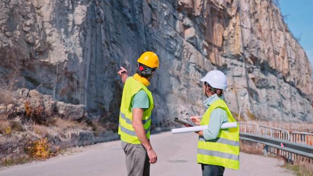 istock Road construction engineers working. Building new highways. 1350848001