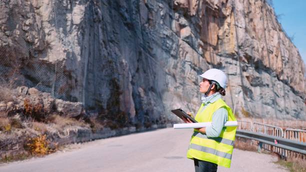 istock Female road construction engineer working. Building new highways. 1350848002