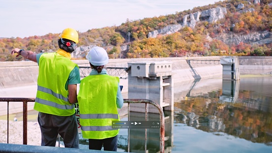 Working day on a hydroelectric power plant. Checking the condition of the power equipment, and analysing the data and the results of measurements with a mobile app.