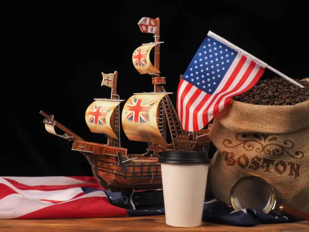 Photo of Boston tea party is symbol of English tea rejection . Distribution coffee in America. USA flag