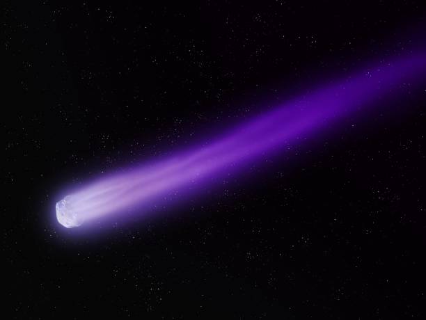 Bright comet in the night sky with a long tail stock photo