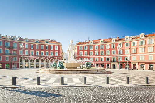 Nice, France - Aug 1, 2021: Apollo statue as a Fontaine du Soleil on Place Massena in Nice France, French riviera