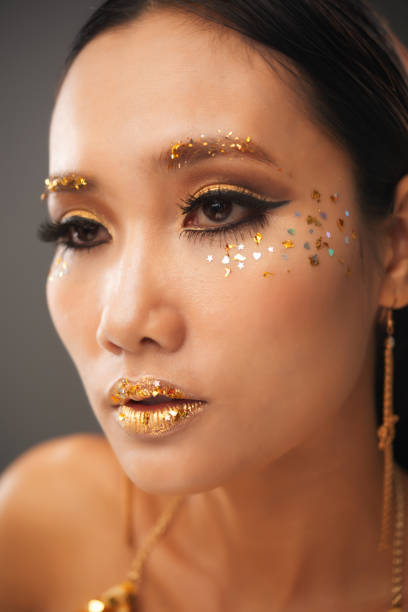 istock Attractive Woman with Golden Make-up 1350853186