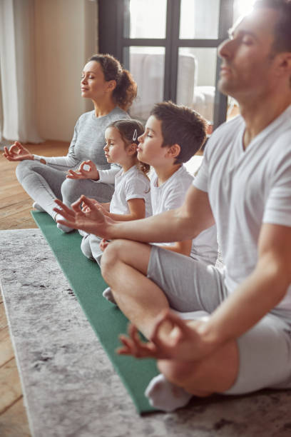 istock All family doing meditation together at home 1350853390
