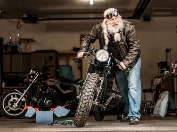 istock Senior man working on his motorcycle 1350853940