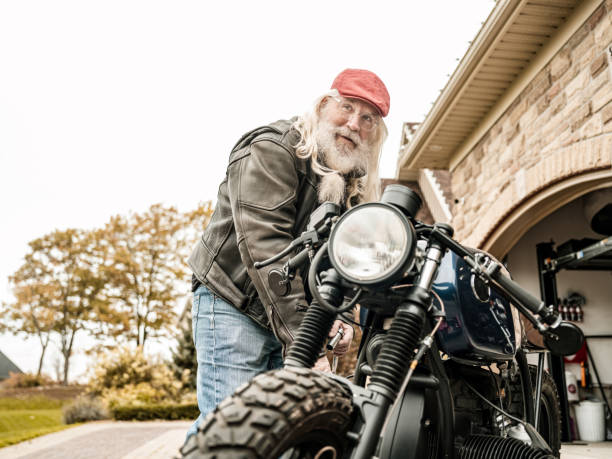 istock Senior man working on his motorcycle 1350854562