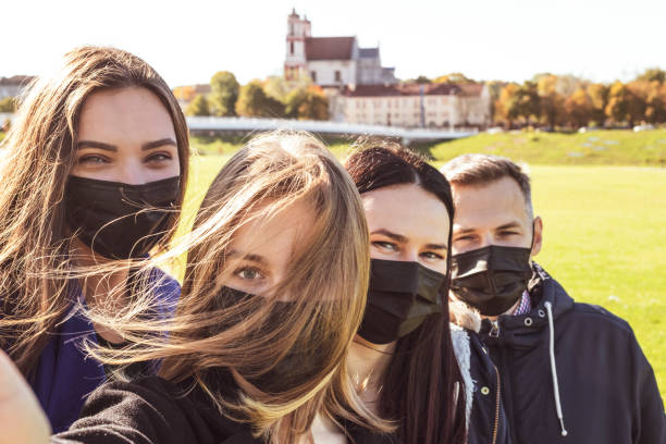 istock Friends selfie with medicine face masks 1350854727