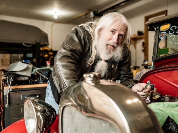 istock Senior man working on his vintage car 1350854758