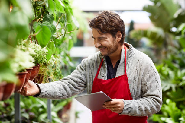 istock Male owner checking inventory on digital tablet 1350854974