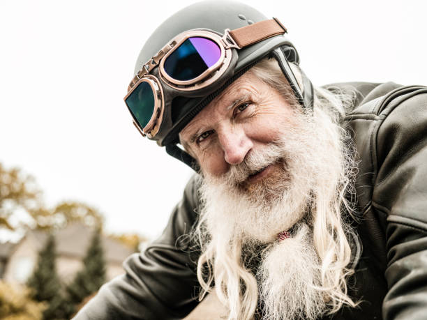 istock Senior man getting ready to ride his motorcycle 1350854986