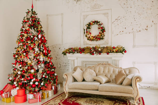 istock Christmas tree with presents underneath in living room 1350855255