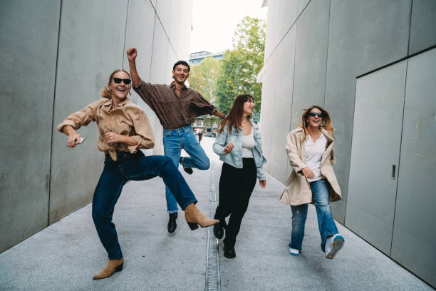 istock Four friends are having fun together outdoor 1350856533