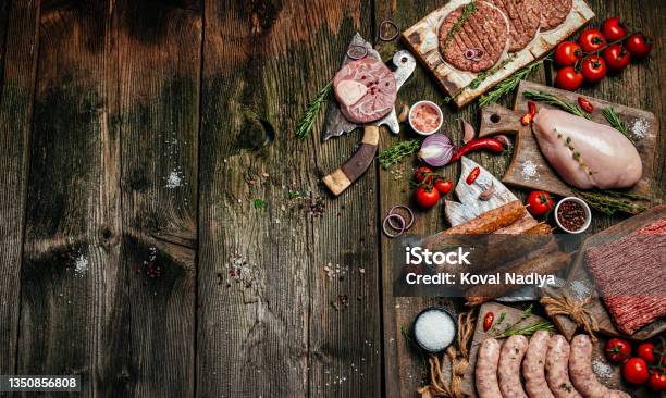 Raw Meat Cutlet And Sausages Shooting For The Catalog Banner Menu Recipe Place For Text Top View Stock Photo - Download Image Now