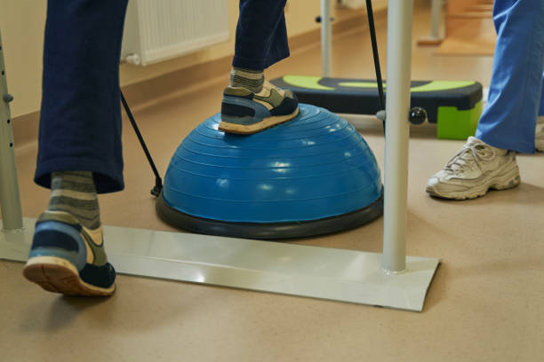 istock Middle-aged patient exercising in neurological rehabilitation facility 1350856973