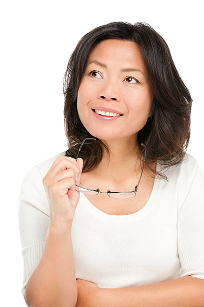 Thinking middle aged asian woman